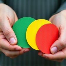 Color-coded environmental stickers in hand